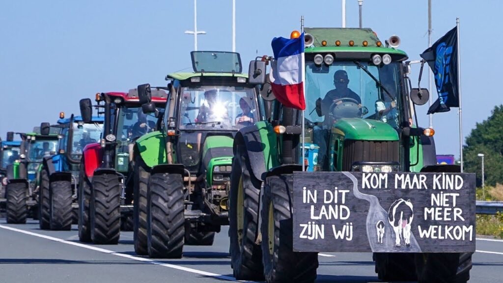 Dutch farmers protest with a convoy of tractors, displaying signs that signal resistance to imports, raising concerns over food supply chains for the UK.