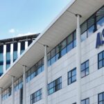 The ASML headquarters in Eindhoven, a symbol of Dutch tech wealth investing in sustainable urban mobility through green infrastructure.