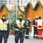 German police and emergency personnel secure a Christmas market in Berlin after thwarting a planned Islamist attack.
