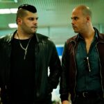 Two actors in a tense scene from the crime drama 'Gomorra,' which has become the focal point of a new French law restricting its discussion.