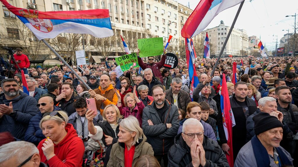 Protesters in Bosnia-Herzegovina rally with Serbian flags, signaling political unrest and potential regional instability following the election of a Dodik-aligned figure.