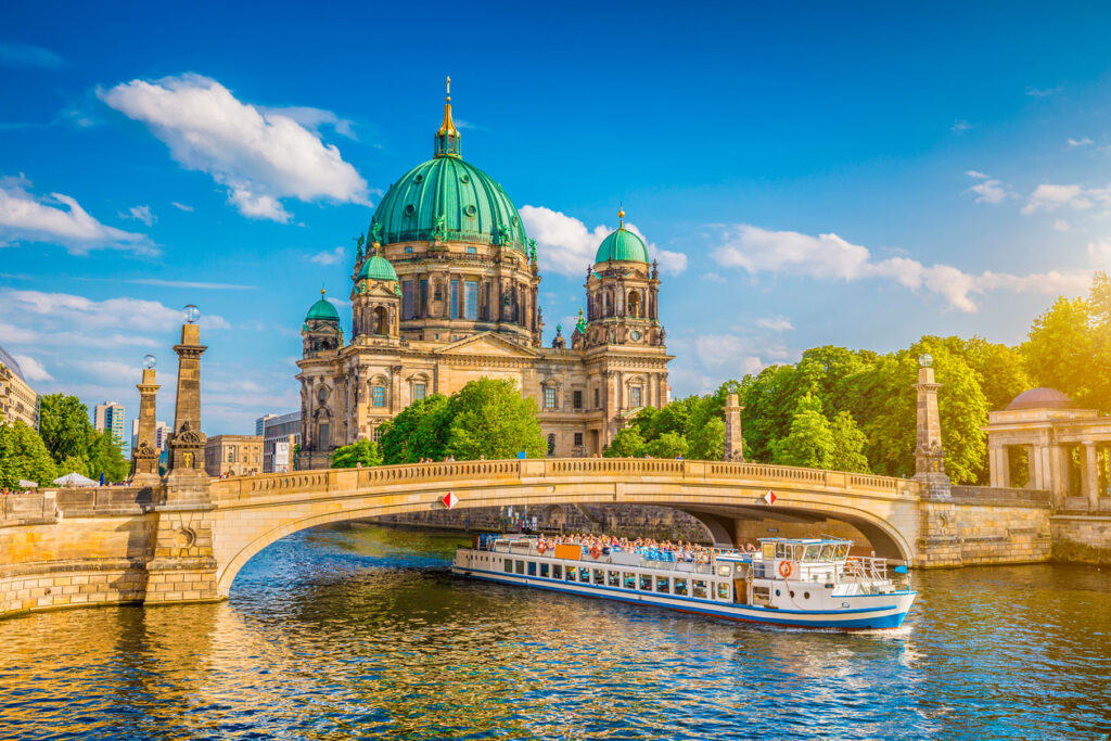 Berlin's iconic landmarks under a sunny sky, symbolizing the city's resilience amid economic concerns.