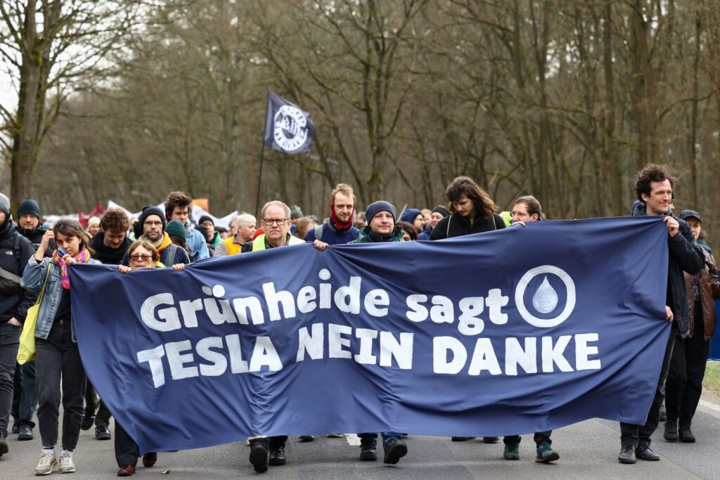 Protesters in Germany reject Tesla's involvement in the green transition, as part of a larger debate over electric vehicle policies and the future of the auto industry.