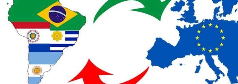 The EU-Mercosur trade deal is visually represented by connecting arrows between Europe and South America, highlighting the economic integration between the two regions.