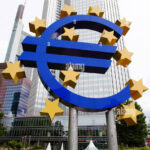 The Euro symbol statue represents the European Central Bank's monetary policy decisions impacting mortgage rates across the eurozone.