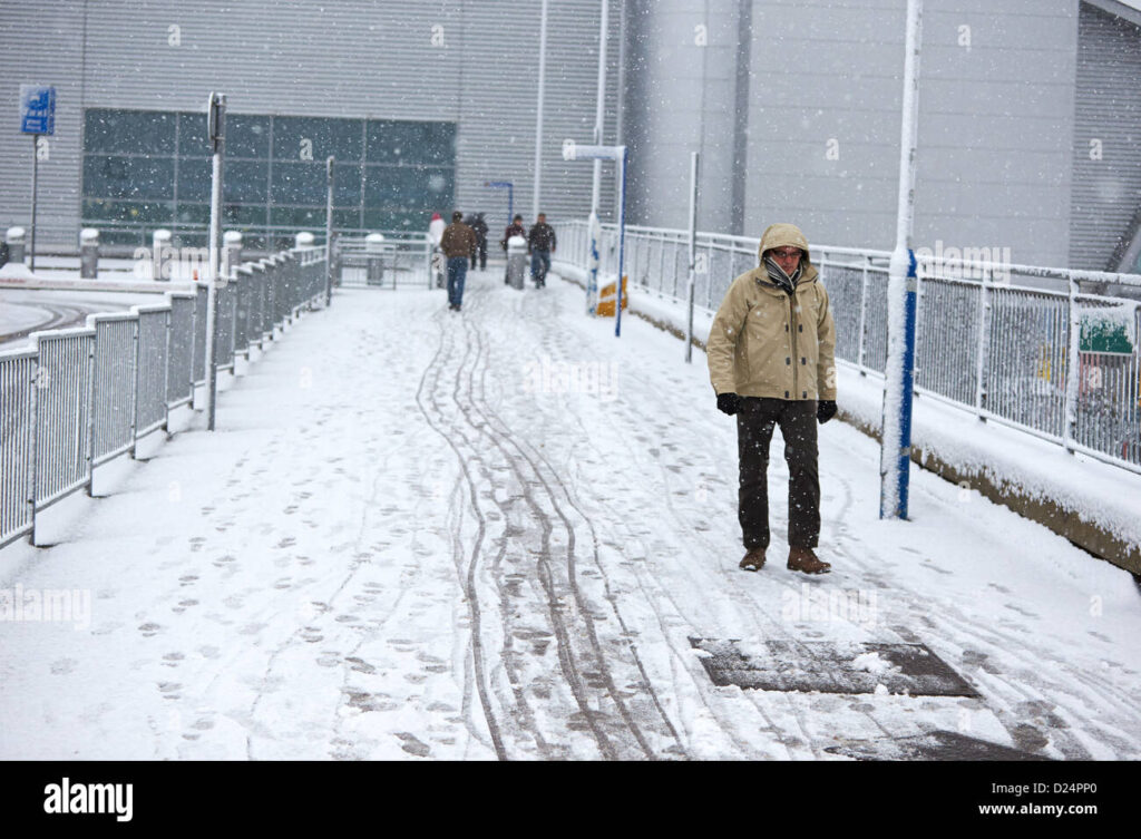 Holiday travelers face delays and disruptions as snow falls at major European airports during the Christmas travel season.