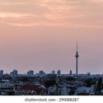 Berlin's skyline at dusk, a symbol of the city grappling with soaring rents and housing affordability in Germany's most expensive metro area.