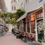 A traditional Dutch café on a quiet street, symbolizing the disappearing neighborhood bars that are at the heart of the nation's changing social landscape.