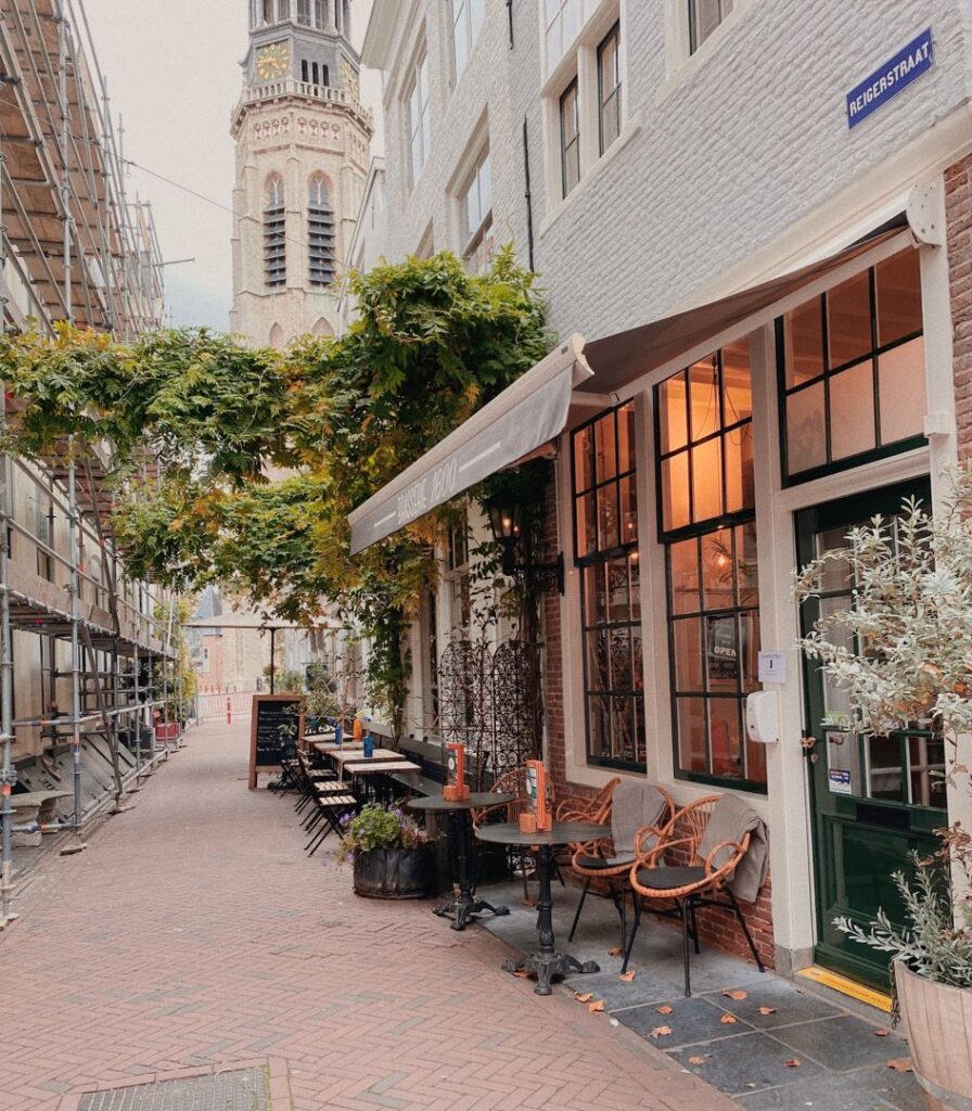 A traditional Dutch café on a quiet street, symbolizing the disappearing neighborhood bars that are at the heart of the nation's changing social landscape.