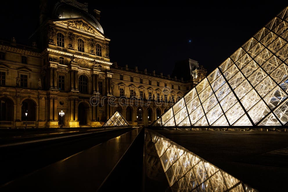 The Louvre Museum at night, a symbol of Europe's cultural heritage, now under scrutiny following a daring burglary that raises urgent questions about the security of its priceless collections.
